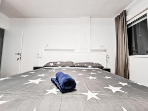 A bed or beds in a room at Lujoso piso en Plaza de Toros