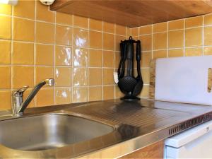 a kitchen with a sink and a counter top at Studio cabine au calme, pieds des pistes, 4 couchages - Risoul 1850 - FR-1-330-234 in Risoul +11 photos