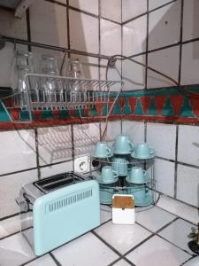 a kitchen with a bunch of dishes and a stove at Apartamentos miradores de granada in Granada