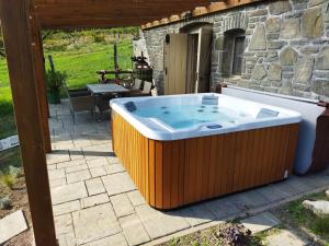 a large hot tub sitting on a patio at Boti Hill Natural in Tihany