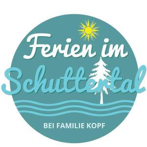 a sign for a tent in a beach with a christmas tree at Ferienwohnung Kopf in Schuttertal