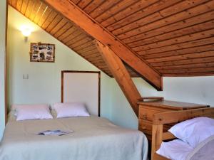 a bedroom with a bed and a wooden ceiling at Appartement 2 pièces, 4 couchages à Risoul 1850 - FR-1-330-39 in Risoul