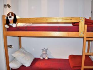 a bunk bed with a stuffed animal on the bottom bunk at Studio 4 pers proche remontées, commerces, animaux admis - Risoul 1850 - FR-1-330-123 in Risoul