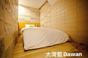 Postel nebo postele na pokoji v ubytování Kenting Dawan Homestay