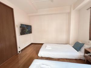 Katil atau katil-katil dalam bilik di PINE TREE HOTEL