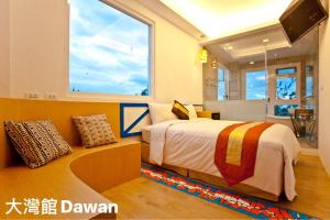 Postel nebo postele na pokoji v ubytování Kenting Dawan Homestay