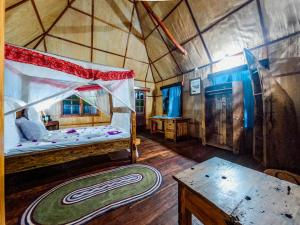 Postel nebo postele na pokoji v ubytování Pemba Eco Lodge
