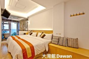 Postel nebo postele na pokoji v ubytování Kenting Dawan Homestay