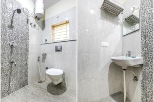 a bathroom with a shower and a toilet and a sink at FabHotel RMS Comforts Yeshwantpur in Bangalore