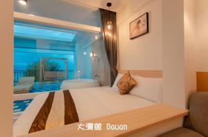 Postel nebo postele na pokoji v ubytování Kenting Dawan Homestay