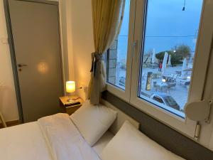 Кровать или кровати в номере Sunset view Rooms