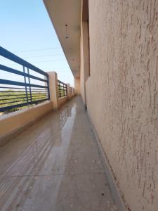 an empty corridor of a building with a wall at Hotel Yolo- Chandigarh in Chandīgarh