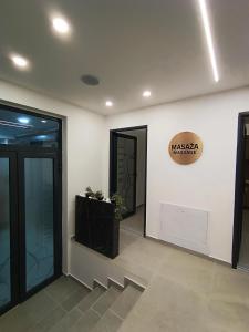 a lobby with two doors and a sign on the wall at President KOP A515 in Kopaonik +102 photos