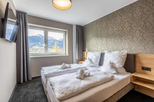 Posteľ alebo postele v izbe v ubytovaní Zugspitz Residence Ehrwald