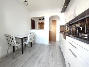 a kitchen with a table and chairs in a room at CASA VICTORIA in Victoria +5 photos