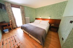 Postel nebo postele na pokoji v ubytování HOTEL SPORTING