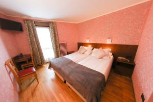 Postel nebo postele na pokoji v ubytování HOTEL SPORTING