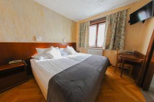 Postel nebo postele na pokoji v ubytování HOTEL SPORTING