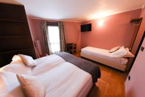 Postel nebo postele na pokoji v ubytování HOTEL SPORTING