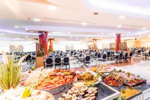 a buffet of food in a banquet hall at Jerusalem Gate Hotel in Jerusalem