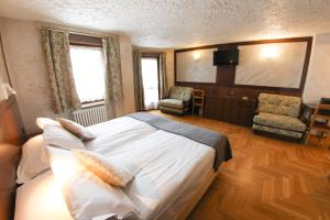 Postel nebo postele na pokoji v ubytování HOTEL SPORTING