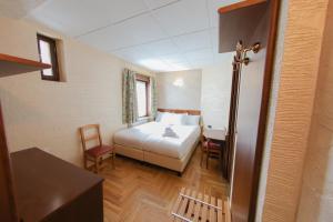 Postel nebo postele na pokoji v ubytování HOTEL SPORTING