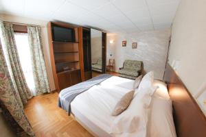 Postel nebo postele na pokoji v ubytování HOTEL SPORTING
