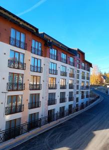 an apartment building on the side of a street at President KOP A515 in Kopaonik