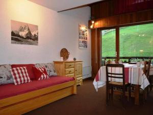 a living room with a couch and a table and a table and a tableministic at Appartement Le Grand-Bornand, 1 pièce, 6 personnes - FR-1-241-5 in Le Grand-Bornand