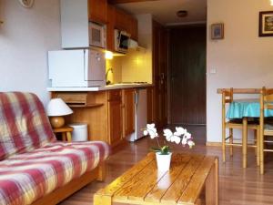 a living room with a couch and a coffee table at Appartement Le Grand-Bornand, 2 pièces, 6 personnes - FR-1-241-21 in Le Grand-Bornand
