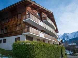 a building with balconies on the side of it at Appartement Le Grand-Bornand, 3 pièces, 6 personnes - FR-1-241-117 in Le Grand-Bornand