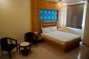 Postel nebo postele na pokoji v ubytování Hotel Grand Lotus