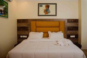 Postel nebo postele na pokoji v ubytování Hotel Grand Lotus
