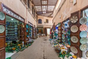 an alley with ceramics in an old market at Riad Myla - 2mn de Jemaa El Fna in Marrakech