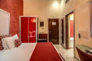 Rome Easy Rooms tesisinde bir odada yatak veya yataklar