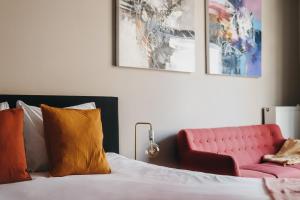 Postel nebo postele na pokoji v ubytování HOLT Hotel