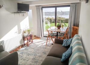 a living room with a couch and a table at Atlantic View Holiday Home Killybegs in Killybegs