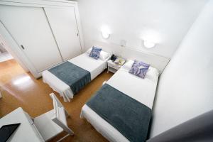 Posteľ alebo postele v izbe v ubytovaní Apartamentos Río Piedras