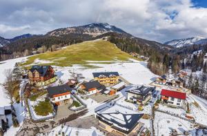 an aerial view of a resort in the snow at Dachstein West Apartment T5 in Russbach am Pass Gschütt