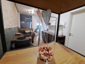 a glass vase sitting on a table in a room at Stunning new apartment with free parking near city centre in Ljubljana