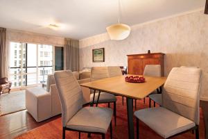 a dining room with a table and chairs at Seaside Escape in Funchal