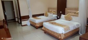 Meru Slopes Hotel客房内的一张或多张床位