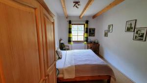 a bedroom with a bed and a window at Penzión Stefanshof in Kremnica +95 photos