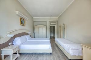 Postel nebo postele na pokoji v ubytování Hotel Bazzoni