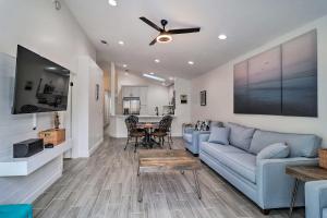 a living room with a couch and a table at Casa Azul Modern Ponte Vedra Beach Bungalow in Ponte Vedra Beach