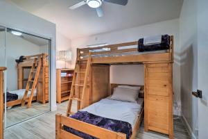 two bunk beds in a room with a mirror at Casa Azul Modern Ponte Vedra Beach Bungalow in Ponte Vedra Beach