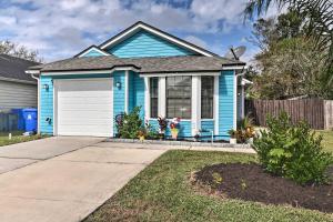 a blue house with a white garage at Casa Azul Modern Ponte Vedra Beach Bungalow in Ponte Vedra Beach