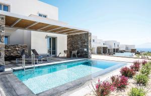 a swimming pool in the backyard of a villa at Summer Senses Luxury Resort in Logaras
