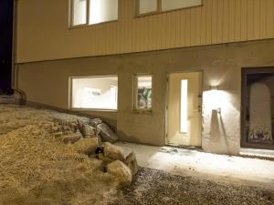 a building with a white door and some windows at Staying Apt 1 - New and modern in Tromsø