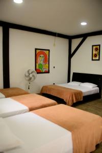 Un pat sau paturi într-o cameră la Finca Hotel Loma Verde